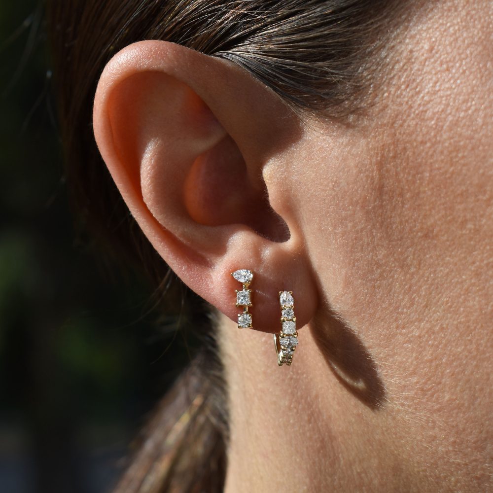 gold hoop earrings white diamond pear shape oval shape brilliant diamond